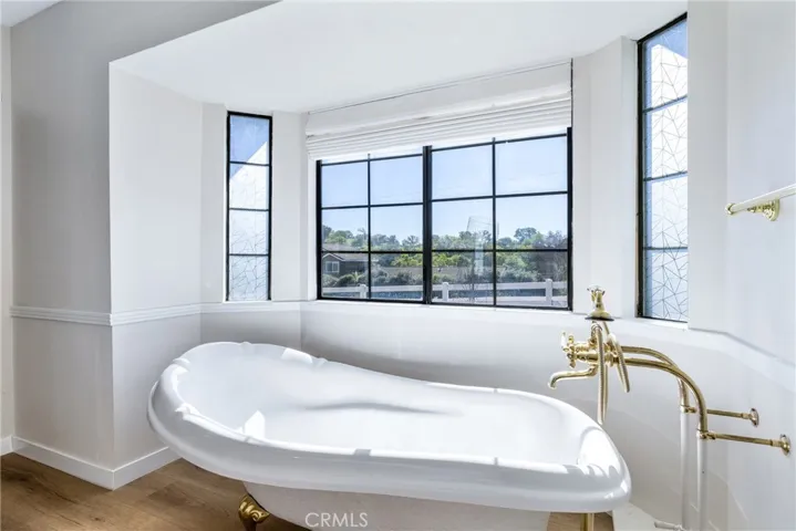 Perfectly placed in the bay window is an absolutely gorgeous claw foot tub. Imagine soaking the day away in this tub!