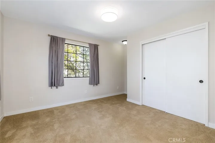 At the top of the stairs, we find bedroom 2 which has a large closet and a niche that would be ideal for a desk.