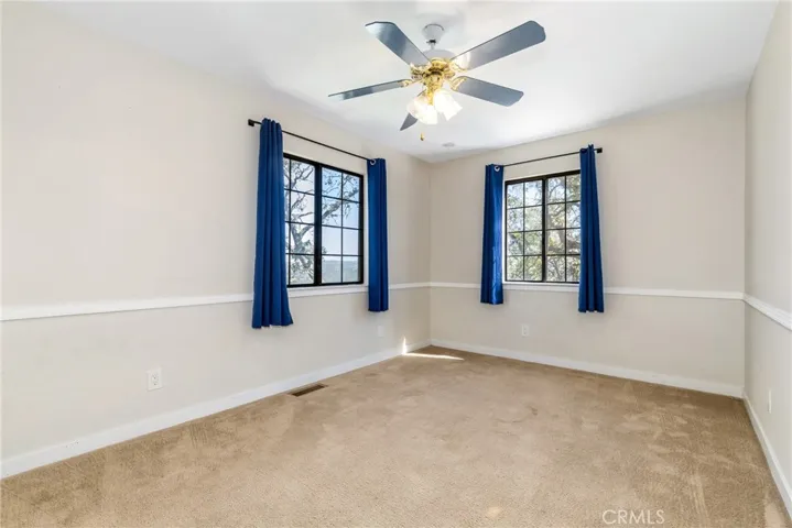 Bedroom 4 offers sensational views and a ceiling fan.