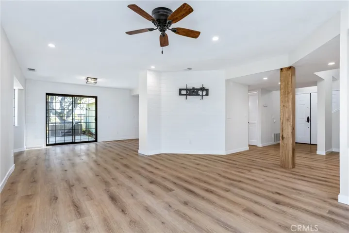 Original photo of living room and dining area.