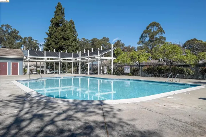 Community pool featuring a patio area