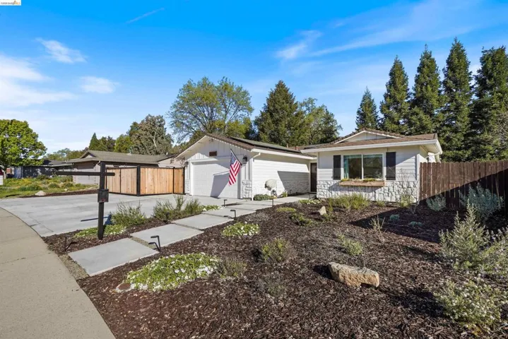 View of front facade with concrete driveway