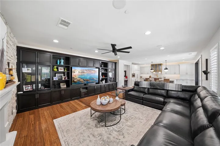 Family room off kitchen and dining area with built in entertainment center.
