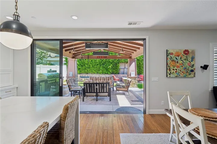 Large slider leading to backyard living area off kitchen