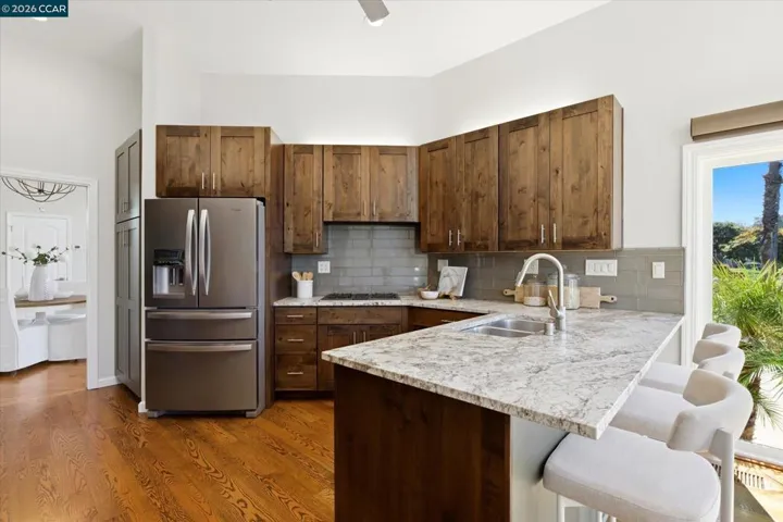 Kitchen has slider access to patio