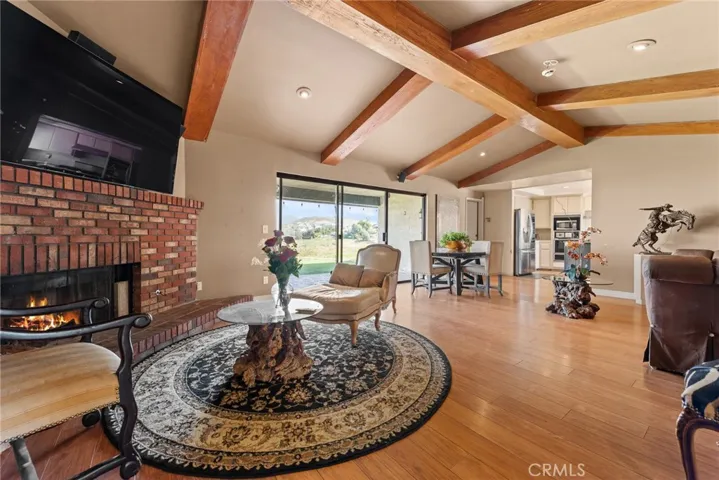 Back family room with wood beam ceilings