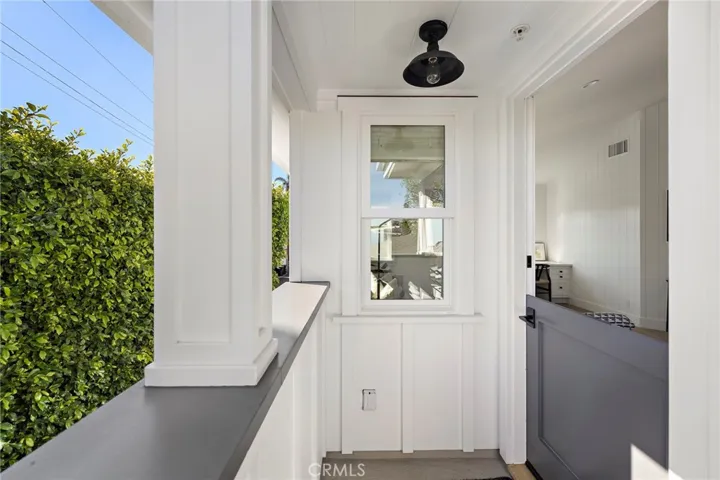 Covered entry and charming Dutch Door