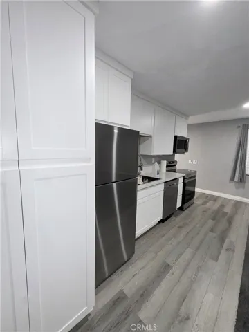 Guest house, kitchen and full-size laundry inside cabinets