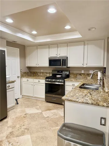 Kitchen-door leads to formal dining area and front living space