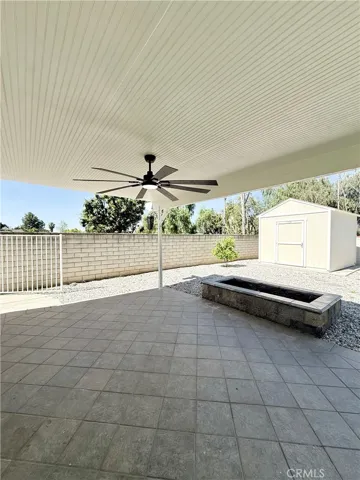 Guest house separate covered patio, celing fan with gas fire pit-storage unit
