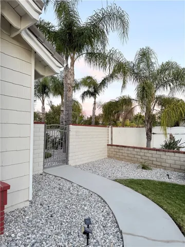 Gate leads to gate that leads to side/ back yard and pool