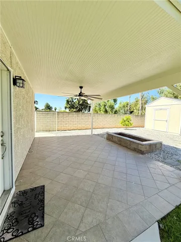 Guest house separate covered patio, celing fan with gas fire pit-storage unit