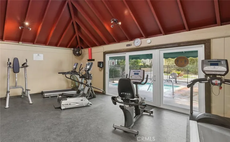 Gym with one way glass doors so people at the pool can't see in.
