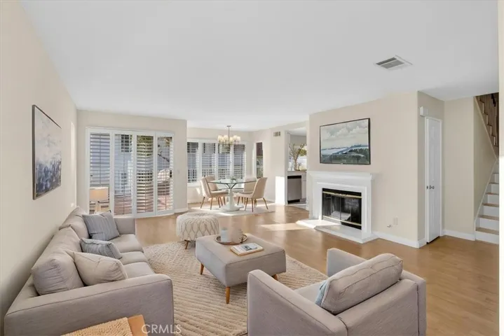 Virtually staged living and dining rooms.