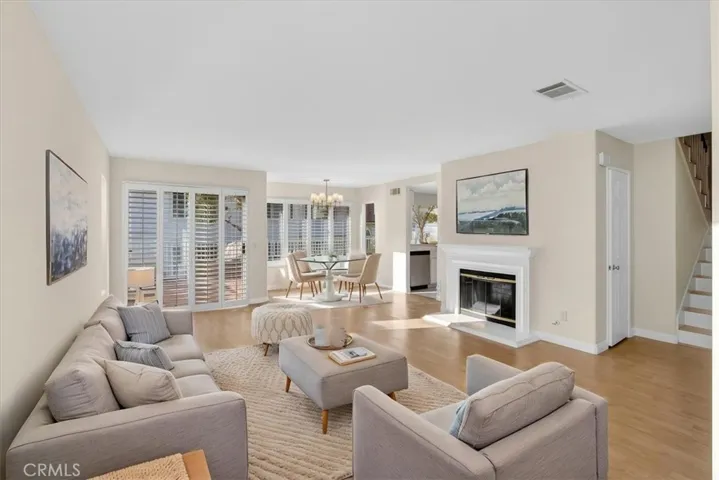 Virtually staged living and dining rooms.