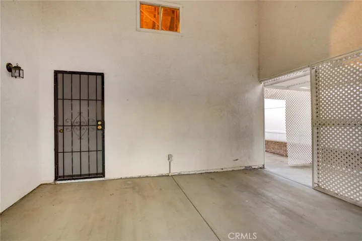 Inside Covered Patio in backyard off of garage