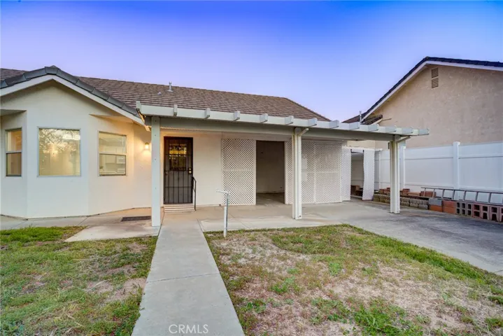 Looking from white gate towards back of house