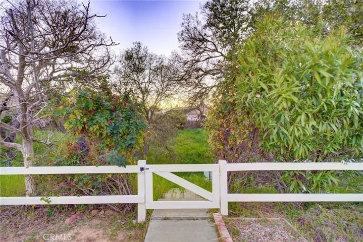Gate to lower portion of back yard looking towards greenbelt