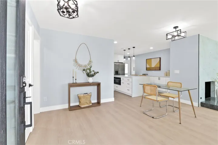 ENTRY LEADING TO DINING AREA, KITCHEN