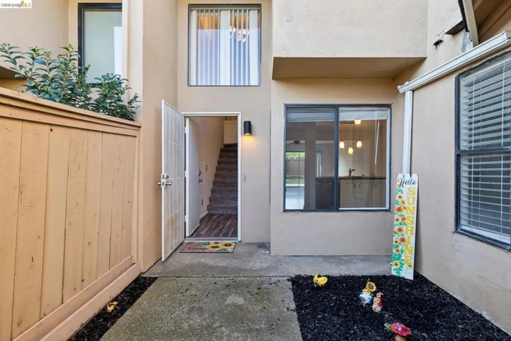 Property entrance with stucco siding