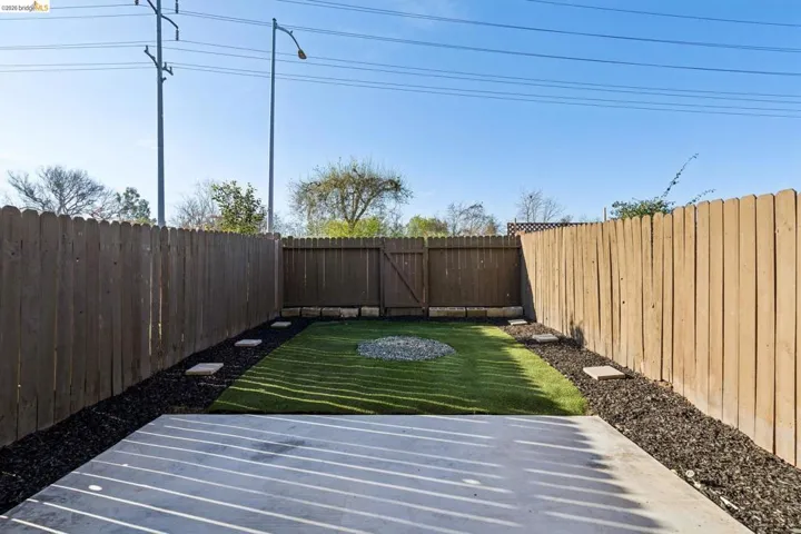 View of fenced backyard