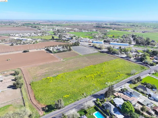 Aerial view of sparsely populated area with extensive farmland