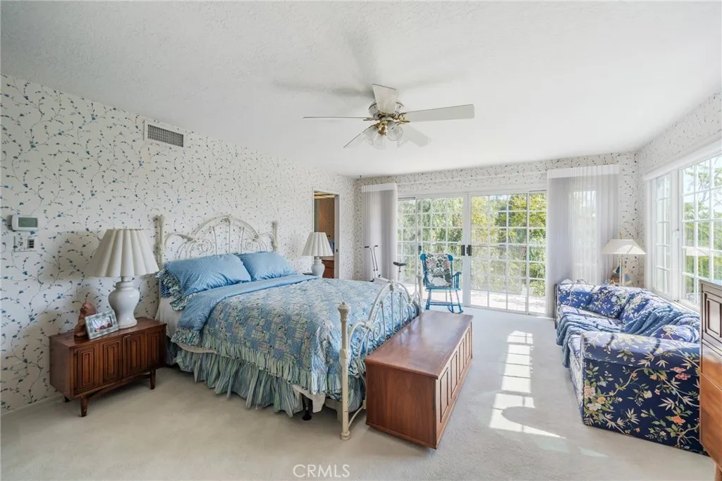 Large primary suite with balcony