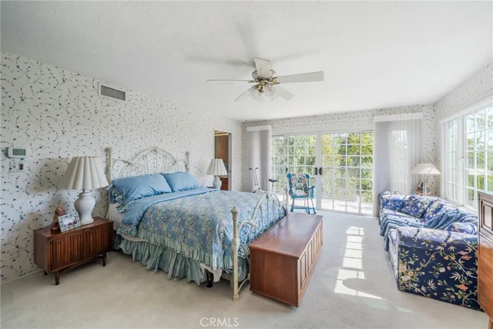 Large primary suite with balcony
