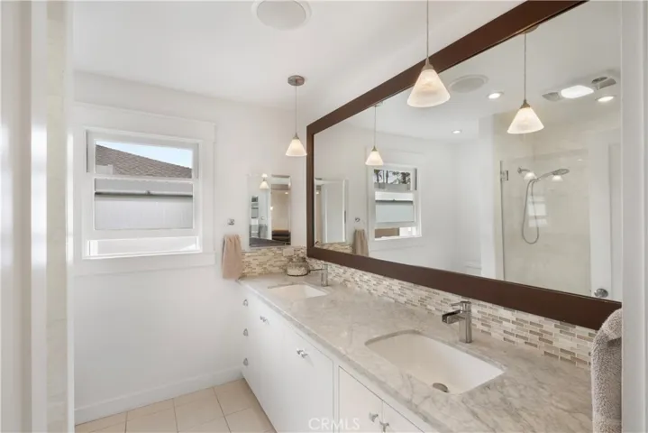 BATHROOM 1 SPA LIKE BUILT CUSTOM CABINETS WITH CLOTHES HAMPER