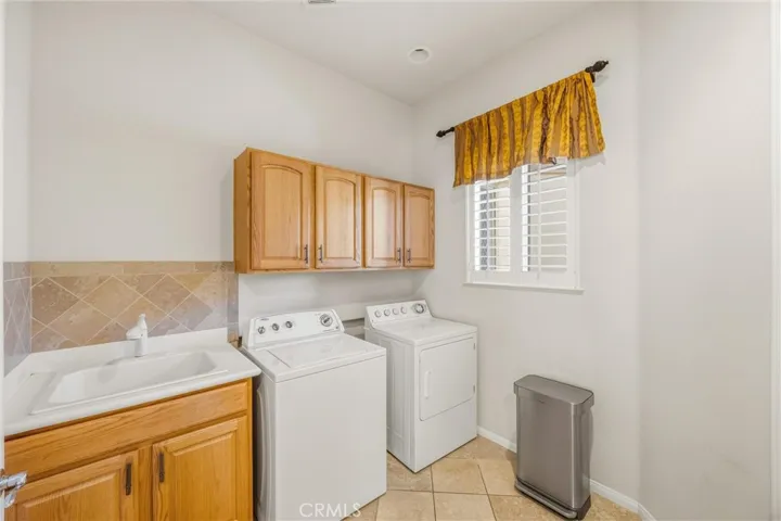 Laundry Room off Kitchen. Includes corner Pantry