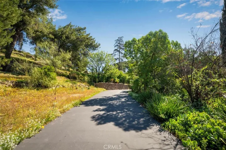 A generously sized driveway wraps around the well maintained center island.