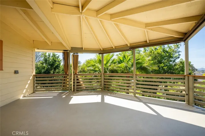 A portion of the deck is covered and complete with sun shades.