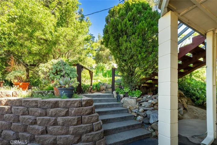 Beautifully landscaped walkway to the upstairs entry.