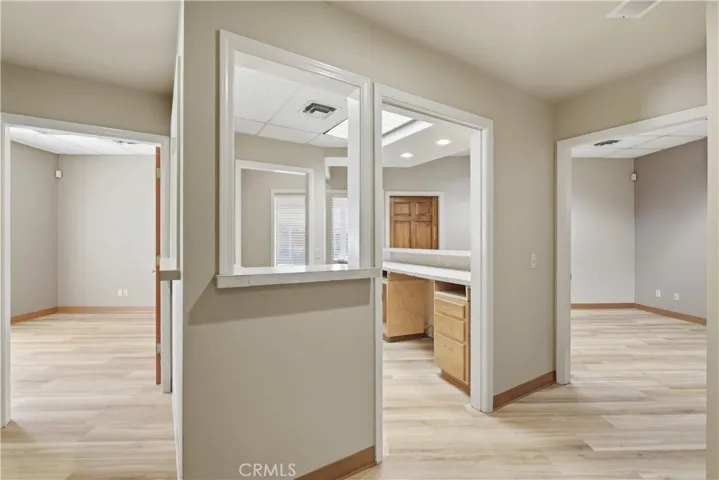 Hallway from front reception/waiting area looking towards front room.