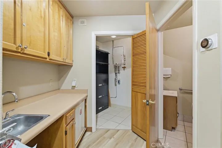 Hallway to storage and bathroom.