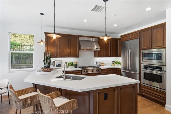 Gorgeous quartz counters and stainless appliances