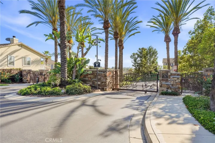 The gates at the entrance of the Reserve South, and your new home.