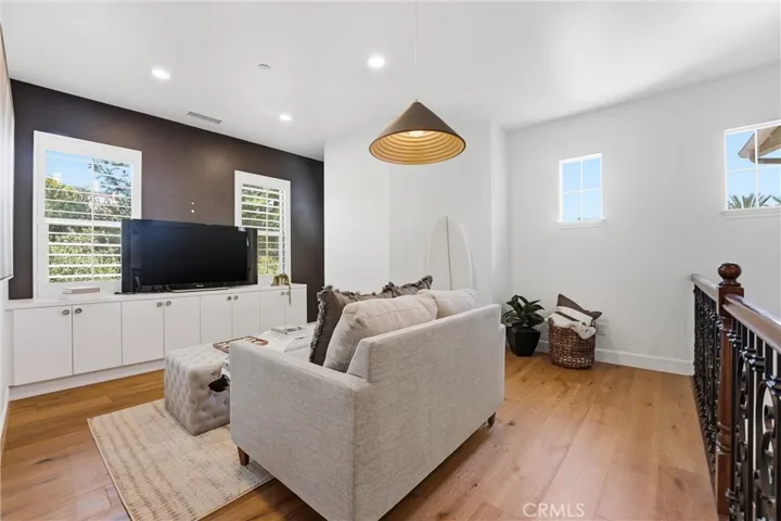 Another view of the loft space. The gorgeous hardwood flooring has been continued upstairs.