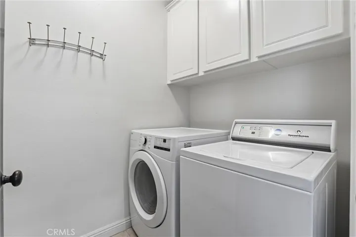 Full-size laundry with ample storage and sink (not pictured)