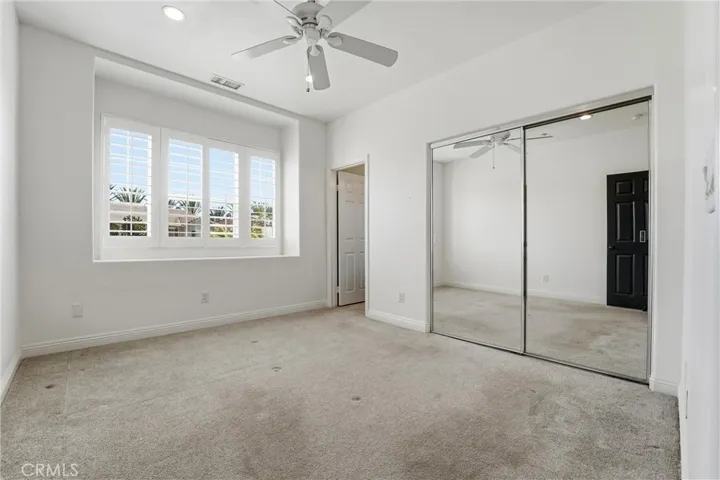 Front secondary bedroom with ensuite bath.