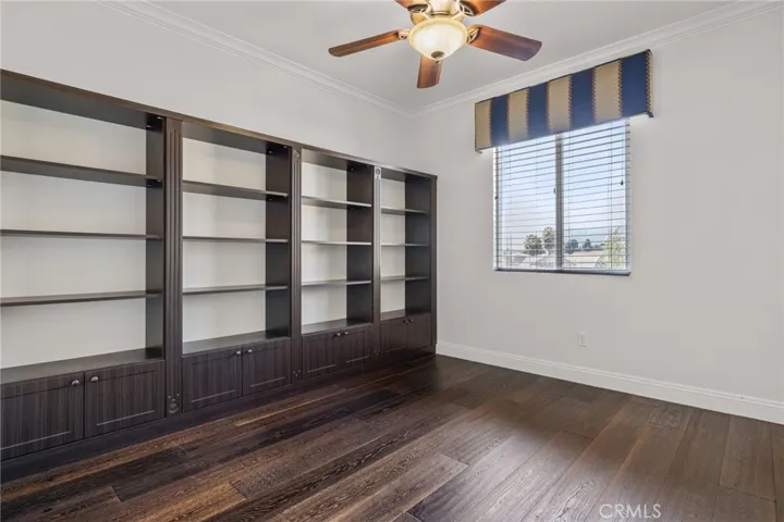 Upstairs bedroom with built in cabinetry.