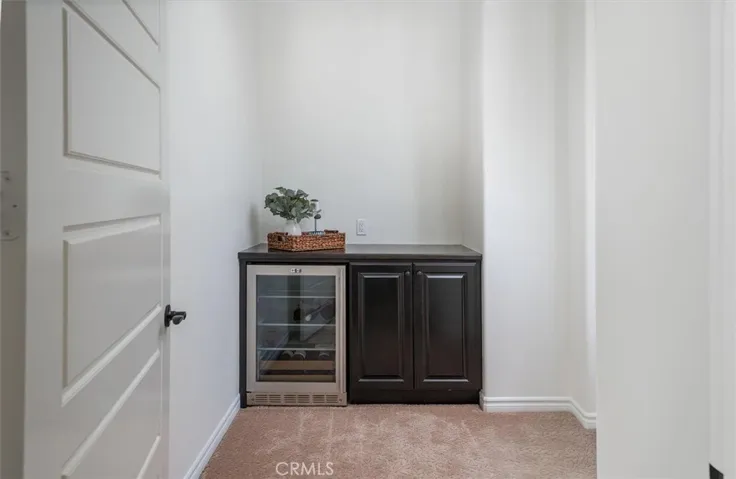 Entry to primary suite with coffee/wine bar