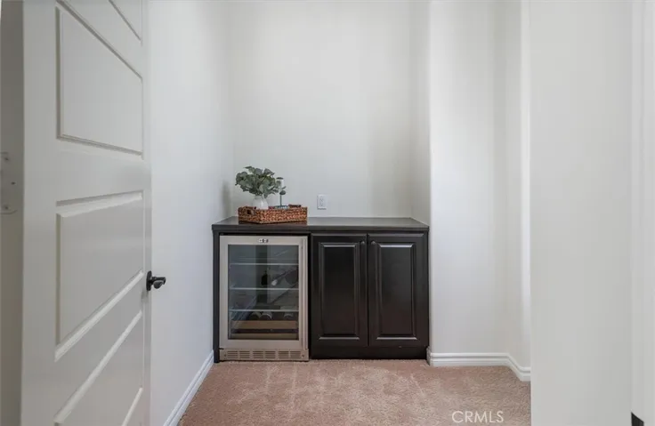 Entry to primary suite with coffee/wine bar