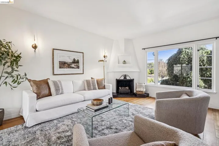Living room with wood finished floors and a fireplace
