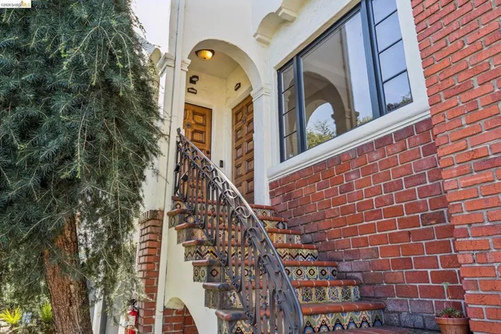 Property entrance featuring brick siding