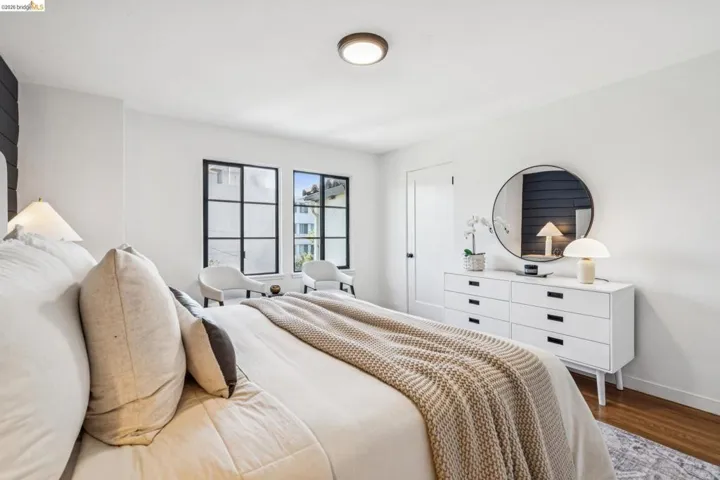 Bedroom featuring wood finished floors and baseboards