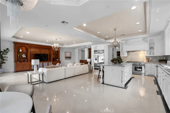 family room leads to massive kitchen