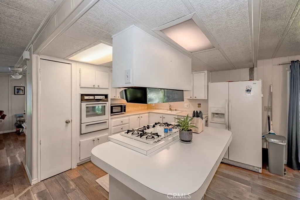 A roomy kitchen and island.