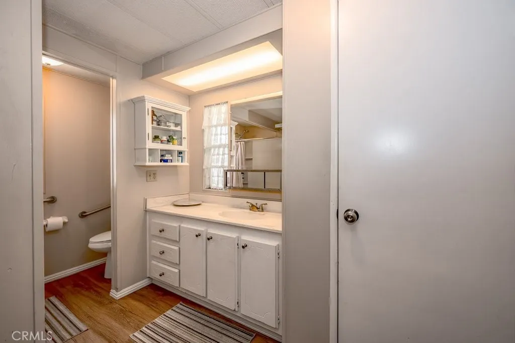 Primary bathroom with a walk-in shower. Grab bars have already been installed.