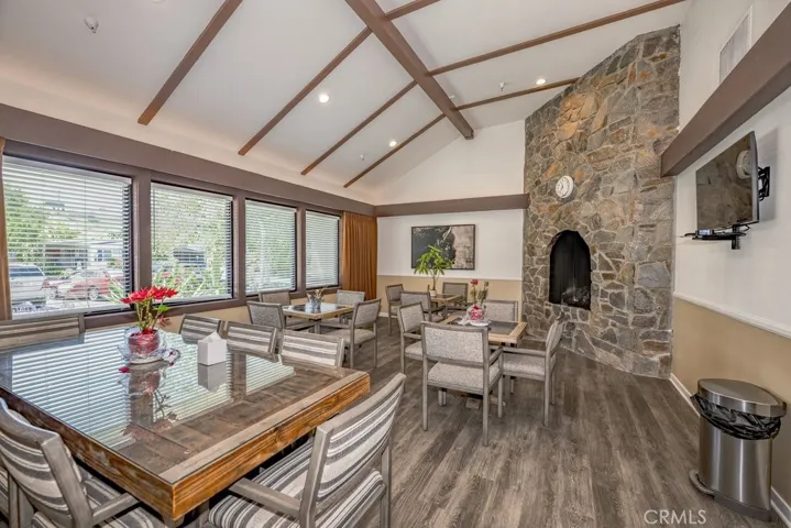 Part of the multipurpose room for dining or visiting friends and family. There is a larger area with a kitchen!